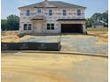 Under construction, this two-story home features a two-car garage and classic architectural details at 410 Hopewell Branch Ct, Smithfield, NC 27577