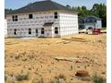 Side view of home under construction showcasing the structure and surrounding lot at 410 Hopewell Branch Ct, Smithfield, NC 27577