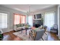 Cozy living room with a decorative fireplace, modern lighting, and stylish furnishings at 508 S Swain St, Raleigh, NC 27601