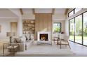 Inviting living room with fireplace, wood beam ceiling accents, large windows, stylish furnishings, and custom built-ins at 5808 Norwood Ridge Dr, Raleigh, NC 27614