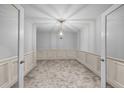 Elegant dining room with decorative molding, a stylish chandelier, and plush neutral carpet at 818 Houston Ct, Haw River, NC 27258