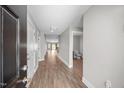 Inviting foyer with wood-look floors leading to a light-filled interior and bathroom at 818 Houston Ct, Haw River, NC 27258