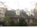 Expansive backyard with mature trees offering privacy and natural beauty at 105 Mary St, Carrboro, NC 27510