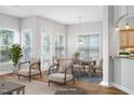 Open concept dining area filled with natural light and an elegant dining table setting at 1100 Dotson Way, Apex, NC 27523