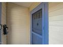 Close-up of the front entrance with a blue-trimmed screen door at 1301 Clarendon St, Durham, NC 27705