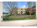 Exterior view from the balcony overlooking the community space and greenery, offering a peaceful setting at 300 Finsbury # 115, Durham, NC 27703