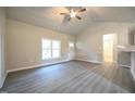 Sunlit living space with stylish flooring, offering a blank canvas for your dream home design at 400 S Eastwood Dr, Benson, NC 27504