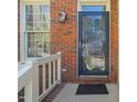 Close-up of the home's elegant front door with decorative glass and brick surround at 5203 Longwood Dr, Durham, NC 27713