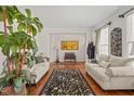 Spacious living room with hardwood floors, neutral paint, and lots of natural light at 5203 Longwood Dr, Durham, NC 27713