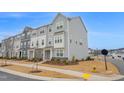 Attractive townhome showcasing light gray siding and manicured landscaping at 5813 Empathy Ln, Raleigh, NC 27616
