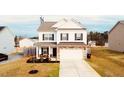 Charming two-story home with stone accents, a two-car garage, and a well-maintained lawn at 612 Marian Way, Sanford, NC 27330