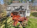 Backyard featuring a tiered deck, and mature trees at 6610 Maynard Farm Rd, Chapel Hill, NC 27516