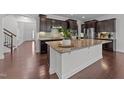 Spacious kitchen island with granite countertops and modern stainless steel appliances at 705 Prince Dr, Holly Springs, NC 27540