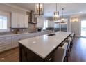 Spacious kitchen featuring a large island, stainless steel appliances, and ample counter space at 717 Penn Rd, Raleigh, NC 27604