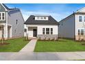 Charming single-Gathering home with manicured lawn and stone accents at 761 Portland Rose Dr, Knightdale, NC 27545