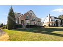 Attractive home with a manicured lawn, stone accents, and trimmed bushes creating great curb appeal at 78 Rolling Meadows Ln, Chapel Hill, NC 27517