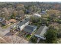 Aerial view showcasing the home's location within a tree-lined neighborhood at 908 Spruce St, Durham, NC 27701