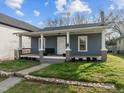 Inviting home exterior with a covered porch, offering curb appeal and charm at 908 Spruce St, Durham, NC 27701