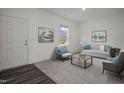 Bright living room featuring neutral walls, stylish decor, and comfortable seating arrangement at 12 Rolling Banks Dr, Louisburg, NC 27549