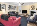 Comfortable living room with fireplace, neutral walls, and plenty of seating options at 2004 Summer Shire Way, Raleigh, NC 27609