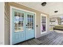 Charming home featuring a light blue glass front door and a welcoming front porch at 288 Joseph Alexander Dr, Fuquay Varina, NC 27526
