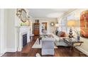 Stylish living room with hardwood floors, fireplace, and comfortable seating, perfect for entertaining guests at 411 Circle Dr, Burlington, NC 27215