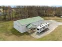 Large outbuilding with RV parked beside it and lots of storage at 4194 Abattoir Rd, Angier, NC 27501