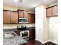 Well-equipped kitchen with stainless steel appliances, granite countertops, and ample cabinet space at 4519 Tarkiln Pl, Wake Forest, NC 27587