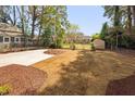 Spacious backyard showcasing newly installed sod and mulch with a privacy fence at 604 Edmund St, Raleigh, NC 27604