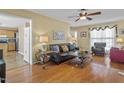 Inviting living room featuring hardwood floors, stylish furniture, and great natural light at 605 Wyndham Dr, Fuquay Varina, NC 27526