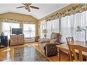 Cozy sun room with lots of light, perfect for relaxing and entertaining at 605 Wyndham Dr, Fuquay Varina, NC 27526
