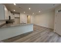 Kitchen featuring granite countertops, stainless faucet, recessed lighting, and neutral wall color at 6405 Granite Quarry Dr, Raleigh, NC 27610
