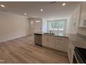 Open concept kitchen with granite countertops and stainless steel appliances offers modern design at 6405 Granite Quarry Dr, Raleigh, NC 27610