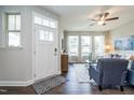 Inviting living area with natural light, a ceiling fan, and a comfortable seating arrangement at 6405 Granite Quarry Dr, Raleigh, NC 27610