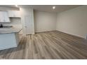 Spacious living area featuring hardwood floors, neutral walls, and natural light at 6407 Granite Quarry Dr, Raleigh, NC 27610