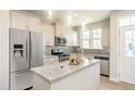 Modern kitchen featuring stainless steel appliances, granite countertops, and a functional kitchen island at 6411 Granite Quarry Dr, Raleigh, NC 27610