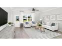 Inviting living room featuring stylish decor, neutral tones, and large windows at 720 Ben Ledi Ct, Raleigh, NC 27603