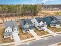 An aerial view shows several two-story homes with well-manicured lawns and garages at 724 Red Arrow Dr, Knightdale, NC 27545