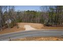 Cleared home lot on an empty lot surrounded by trees, ready for building a dream home at 0 Jasmine Rd, Fuquay Varina, NC 27526