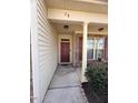 Inviting entryway featuring a covered porch with decorative lighting and stylish front door at 78 Florence Dr, Clayton, NC 27527