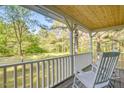 Relaxing front porch with rocking chairs, offering a serene outdoor living space at 1301 Flying Hawk Rd, Apex, NC 27523