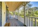 Inviting front porch with rocking chairs, perfect for relaxing and enjoying the outdoors at 1301 Flying Hawk Rd, Apex, NC 27523