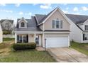 Charming two-story home with a two-car garage, and a quaint covered porch at 1945 Red Quartz Dr, Raleigh, NC 27610