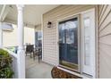 Cozy front porch with seating, and a decorative door at 1945 Red Quartz Dr, Raleigh, NC 27610