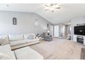 Spacious living area with vaulted ceilings, plush carpet, neutral walls, comfortable seating, and ample natural light at 31 Harrow Ter, Roxboro, NC 27574