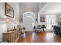 Elegant foyer boasts hardwood floors, a high ceiling, and abundant natural light at 3655 Pleasants Ridge Dr, Wake Forest, NC 27587