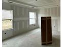 Well-lit bedroom ready for personalization, offering a tranquil retreat within the home at 380 Pecan Valley Way, Four Oaks, NC 27524