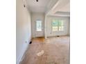 A spacious living room features a large window with trim, and fresh paint at 60 Moonraker Dr, Spring Hope, NC 27882