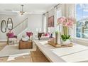 Airy living room showcasing large windows, stylish decor, and an inviting seating arrangement at 607 Callan View Ave, Wake Forest, NC 27587