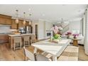 Expansive view of the open kitchen and living area featuring wood floors and stylish decor at 607 Callan View Ave, Wake Forest, NC 27587